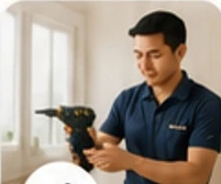 Technician using a drill for home maintenance